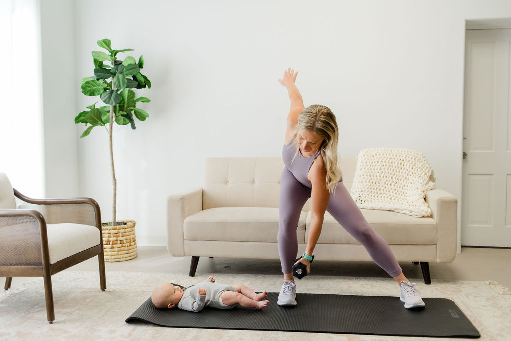 mom doing exercise with her baby to prevent leaking when coughing. 