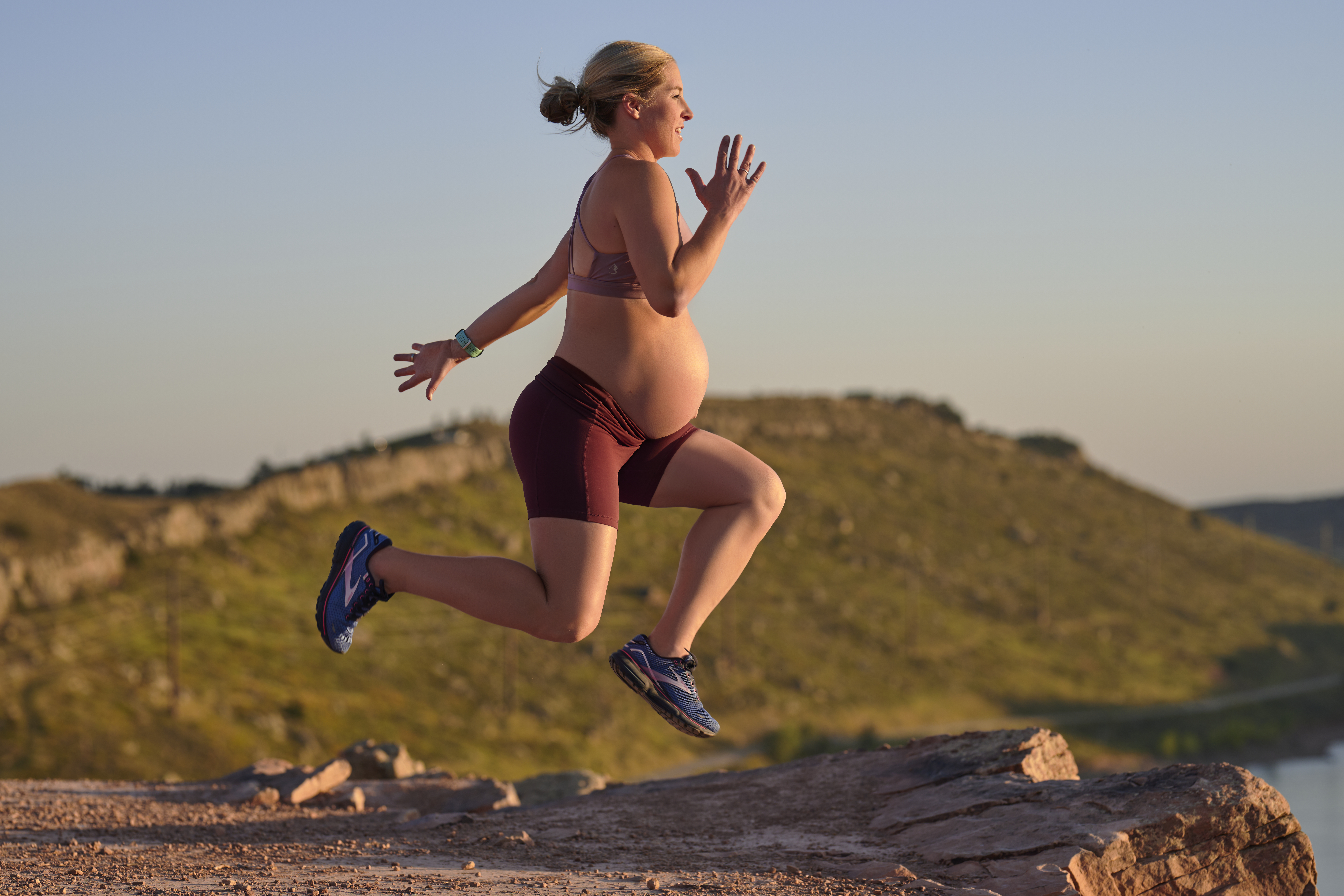 pregnant woman jumping.