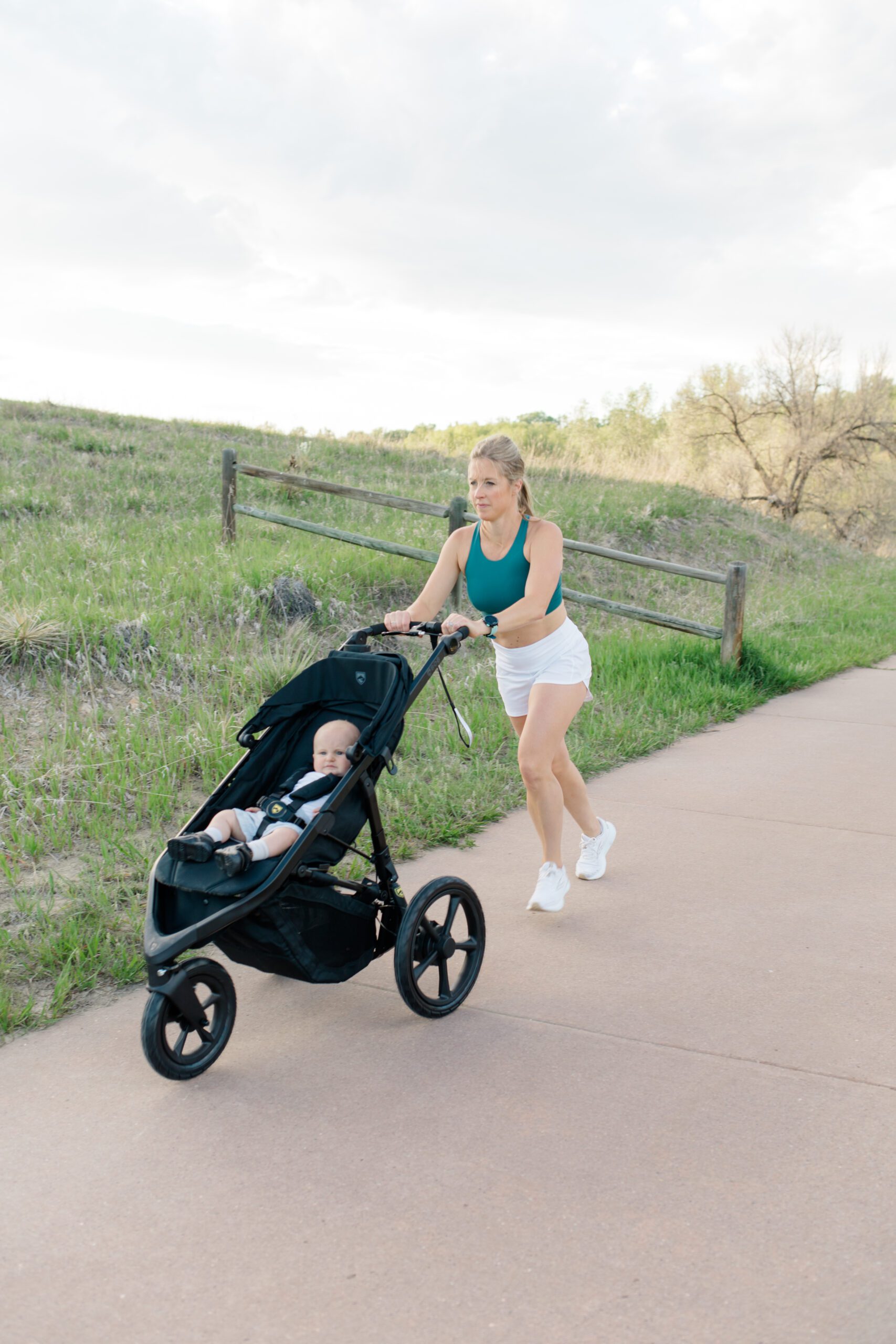 Mom running with a stroller. Running while breastfeeding.