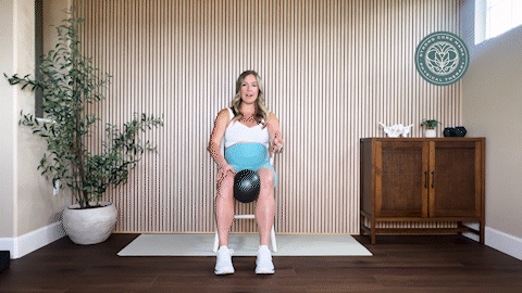 Seated scissor slides pelvic floor PT exercise.